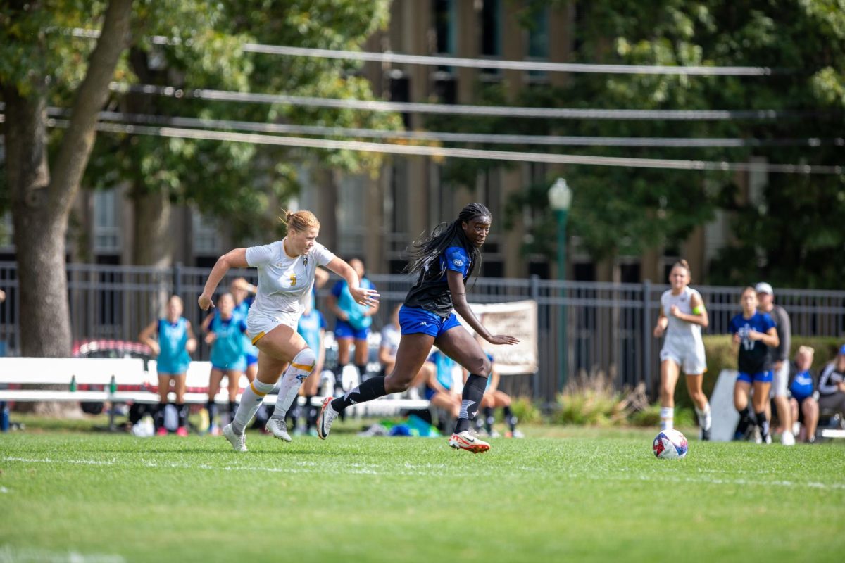 Freshman Forward Alex Tetteh dribbles the soccerball pass MoreHead St. defenders at Eastern Illinois University Lakeside Field Thursday afternoon.