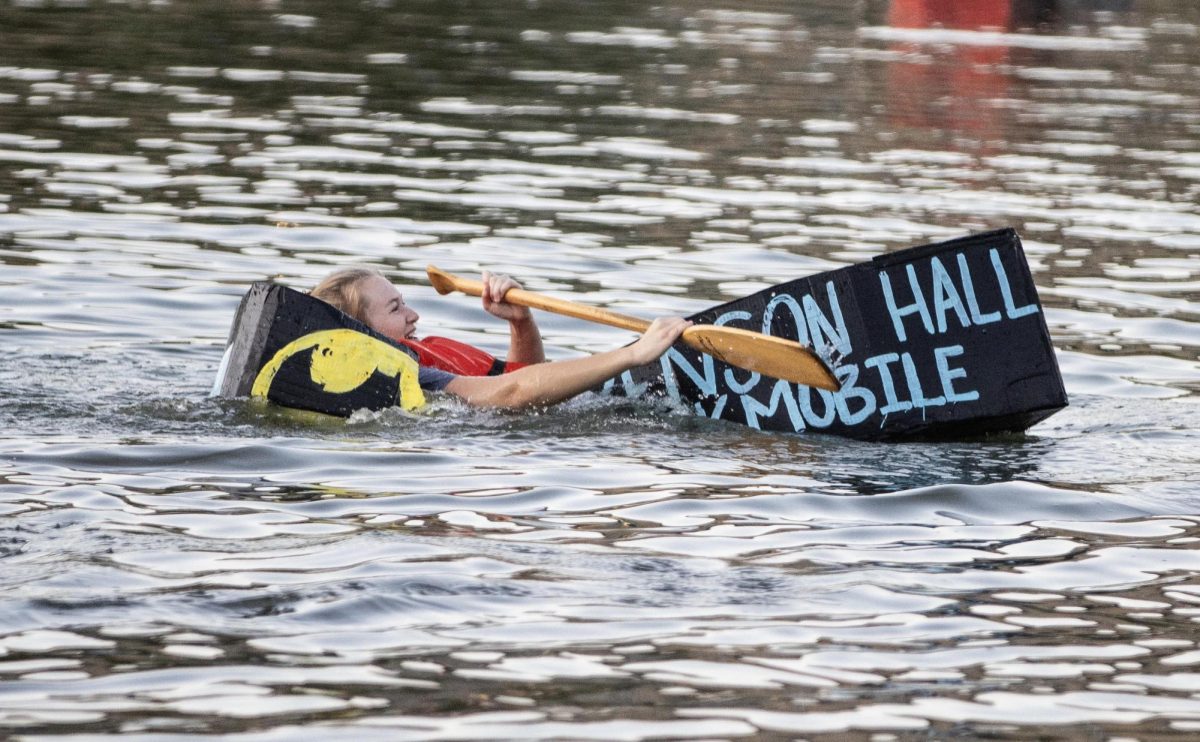 At the boat race on campus pond, Lawson Halls boat starts to sink while on the way back to land Thursday evening.
