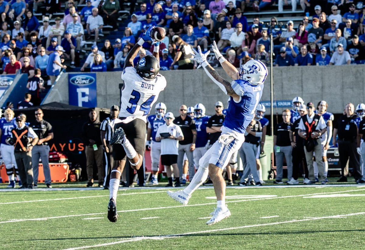 Safety NiJhay Burt (34), intercepts the ball for a 67 yard return touchdown. The Panthers won 27-0 against the Sycamores Thursday night. 