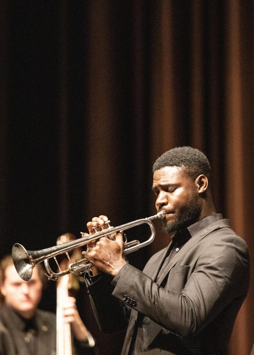 Kehinde Omosor performs a solo in the song Port o Call by Michael Sweeney at the Jazz Showcase in Doudna Fine Arts Center Thursday evening.