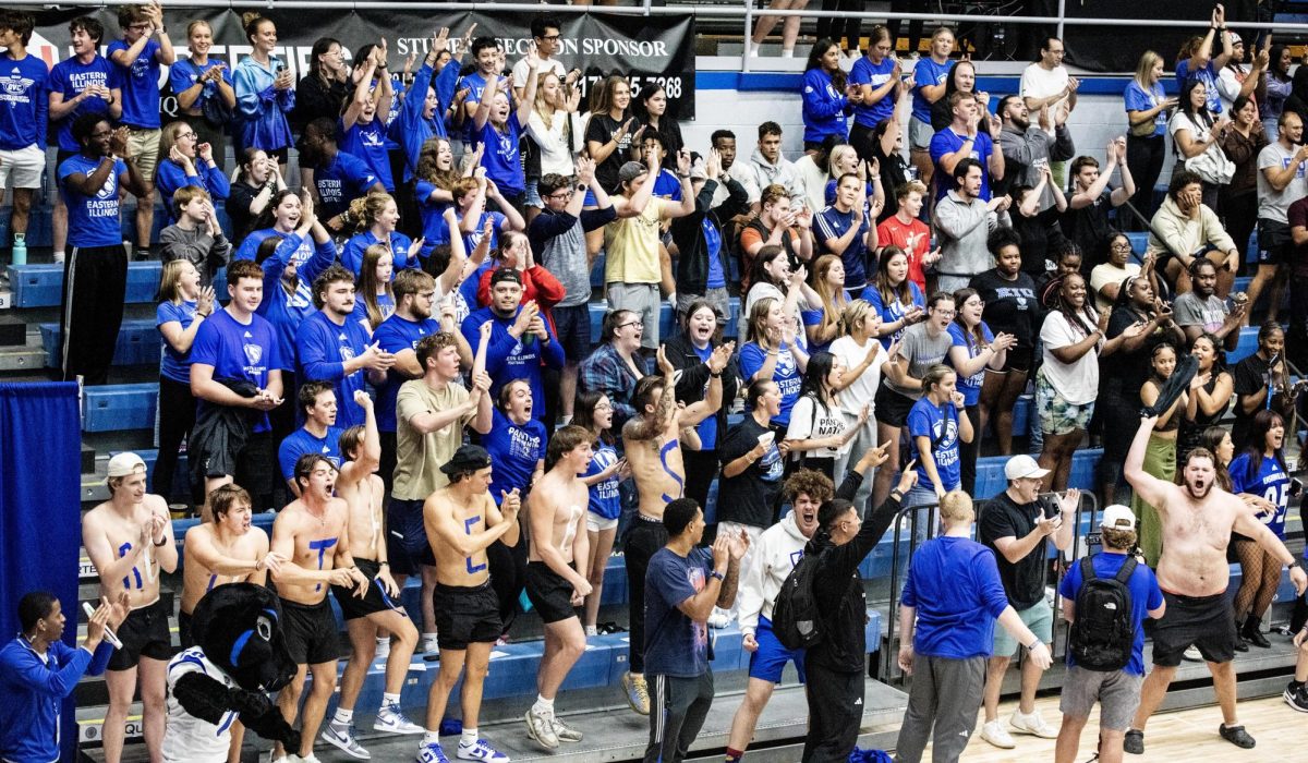 The student section loudly cheer and show support after Easterns volleyball team win a met vs. the University of Missouri. The Panthers won 3-0 against the Tigers Thursday night. 