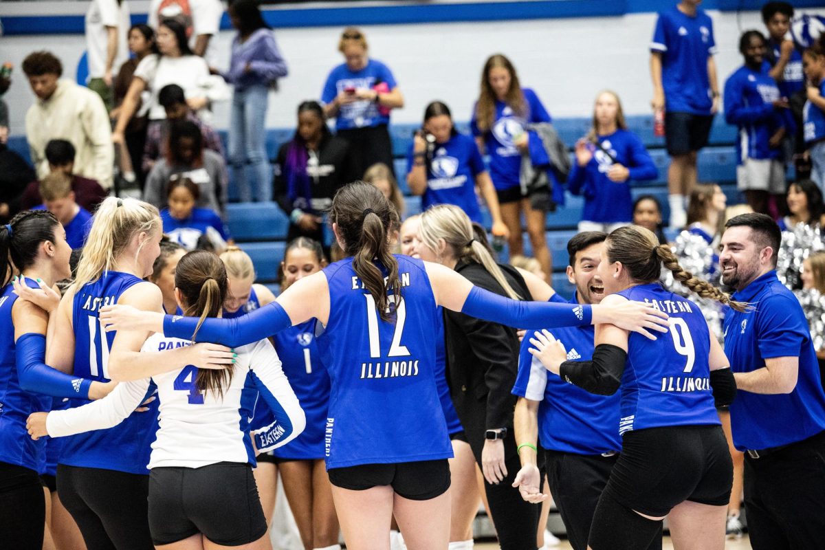 Easterns volleyball team celebrate their 3-0 win against the University of Missouri Thursday night. 