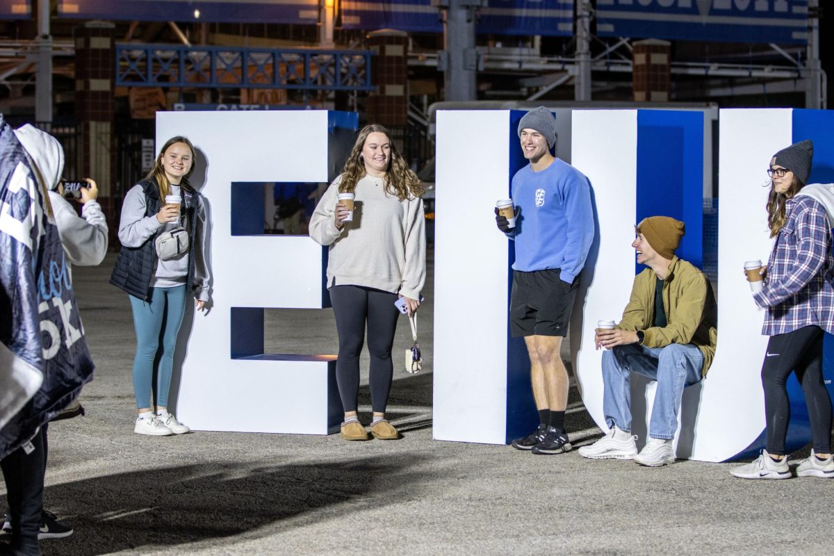 Students from Eastern Illinois University take pictures together during Block Party Pep Rally event at O‘Brien Stadium Friday night.