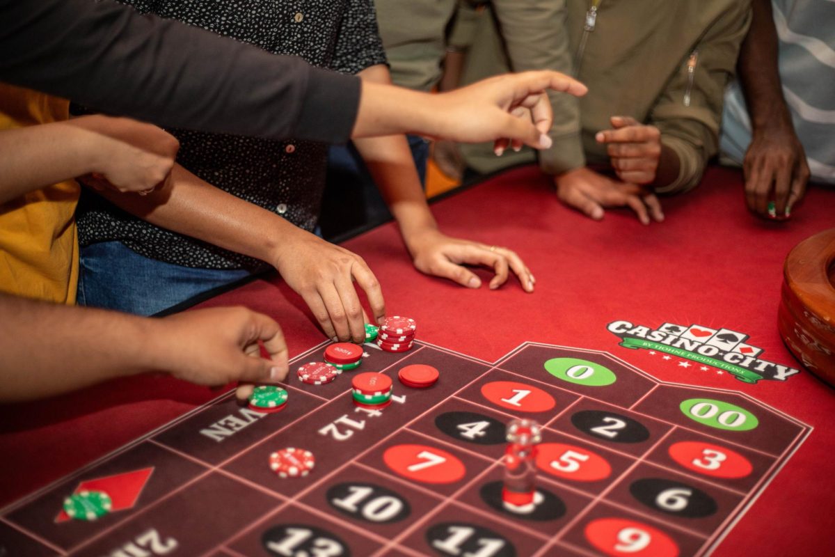 Students play Roulette at Casino Night for a chance to win mystery boxes and Prizes at Martin Luther King Jr. University Union Grand Ballroom Thursday evening.