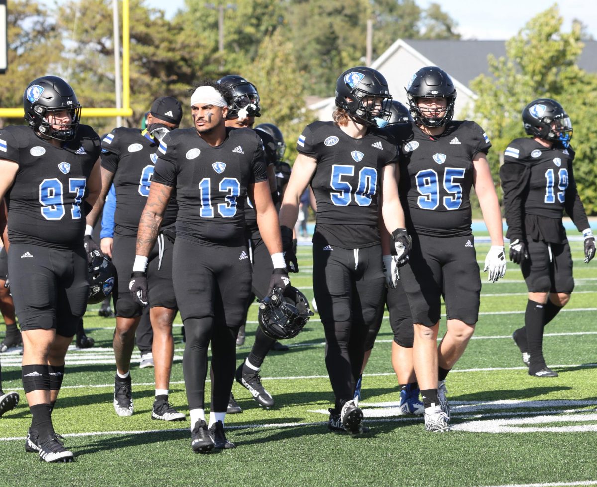 Eastern Football team walks onto the field after timeout during their Homecoming football game Saturday afternoon.