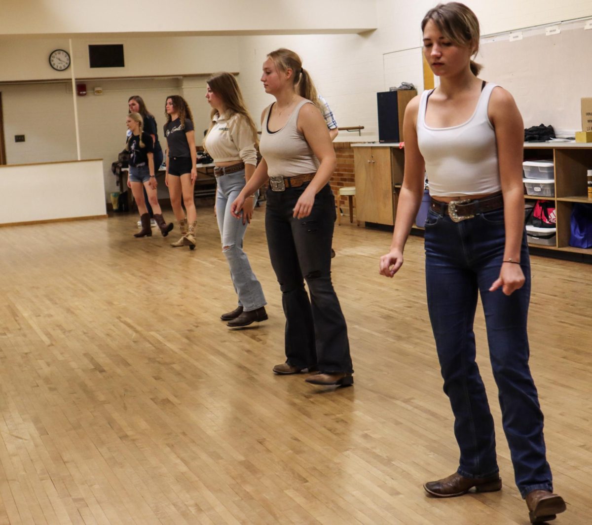 Eastern students practice line dancing routines in McAfee Gym underground Friday evening.