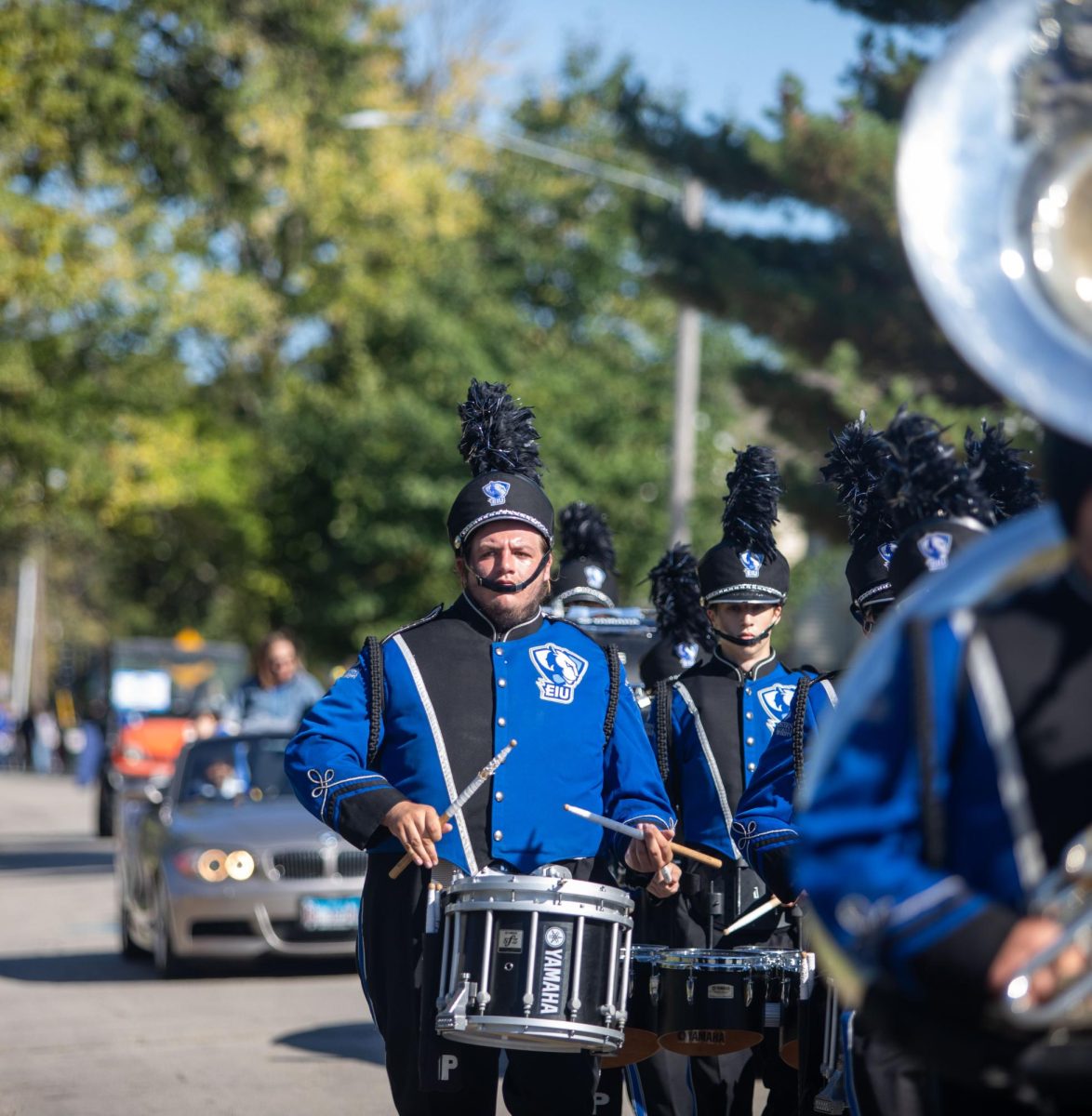 Garrett Jackson, a nursing major, plays the snare during the Eastern Illinois university Homecoming parade Saturday afternoon.