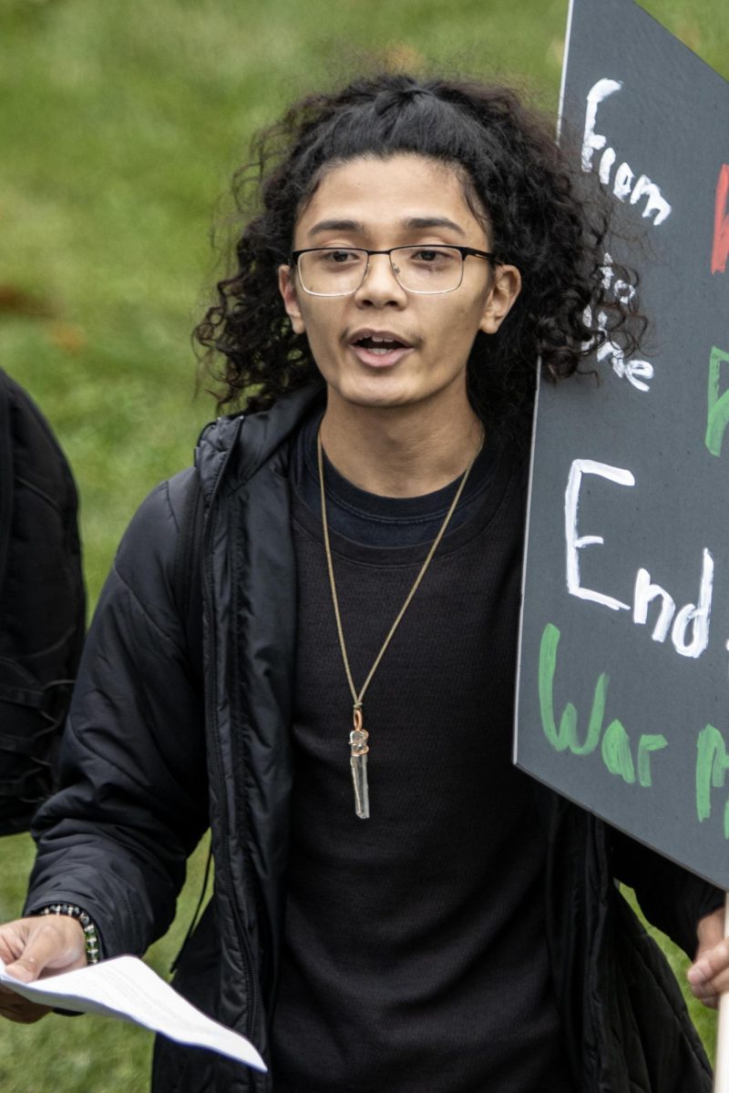 Jason Farias, a senior history education major, leads with a speech during a student walkout demanding a free Palestine at the Mellin Steps outside the Doudna Fine Arts Center in protest of the Israel genocide on Palestinian civilians Wednesday afternoon. Farias said there were around 100 other schools in the nation participating in the walk. 