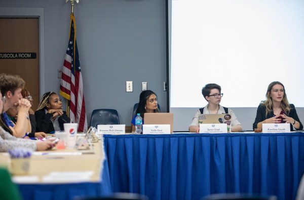 Nidhi Patel, the president of student body listens as Karolina Guzek, speaker of the student senate begins the student government meeting in Martin Luther King Jr. Union wednesday evening.