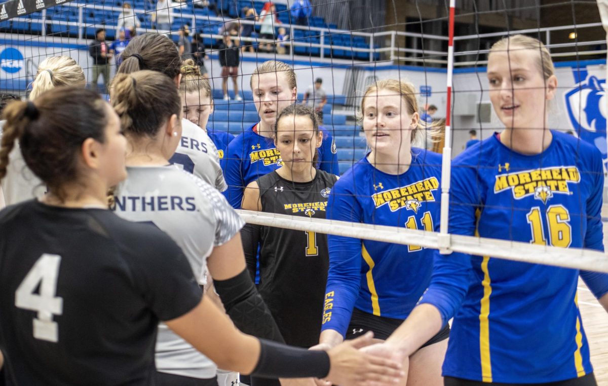 Members of the Morehead State Eagles volleyball team bid farewell to the Eastern Illinois University Panthers volleyball team after the first game in a doubleheader Thursday evening at Lantz Arena. The two teams will play again Friday at 4 p.m.