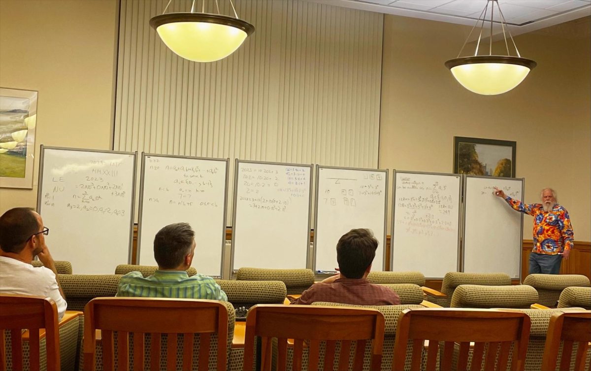 Guest speaker Bruce Reznick explains how his theory is supported during his lecture in Booth Library.