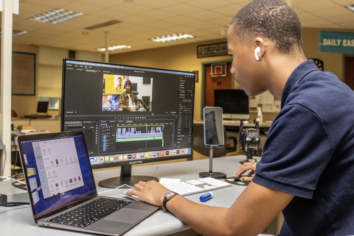 News Editor for the Daily Eastern News, Camron Hardy, a junior journalism major, works on editing his Two Dudes Talk Movies podcast in the newsroom of Buzzard Hall.