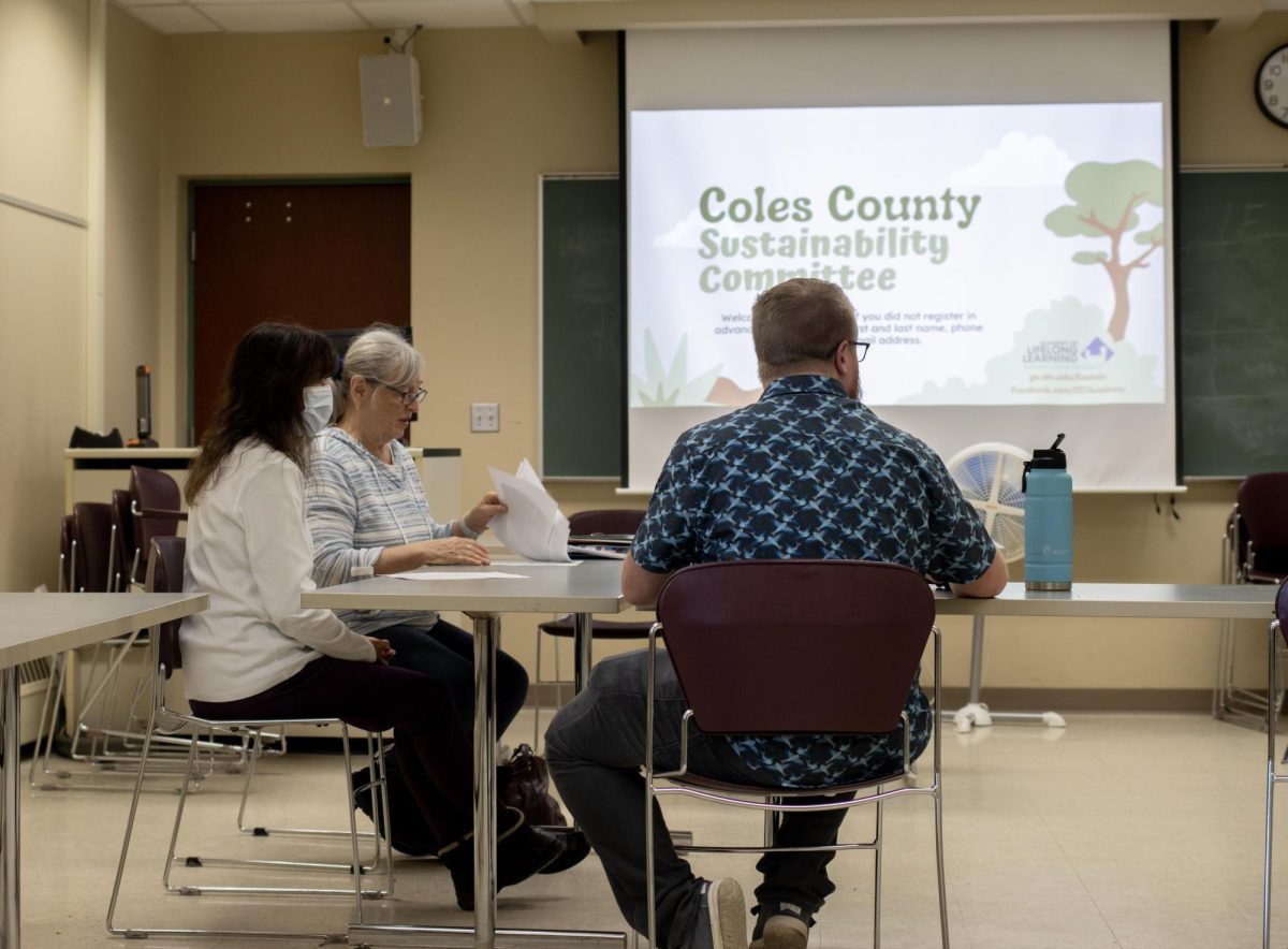 Daniel Douglas, program coordinator at the school of extended learning, chairs the Coles County Sustainability Committee meeting centered on tackling the lack of recycling in the county on Wednesday afternoon.