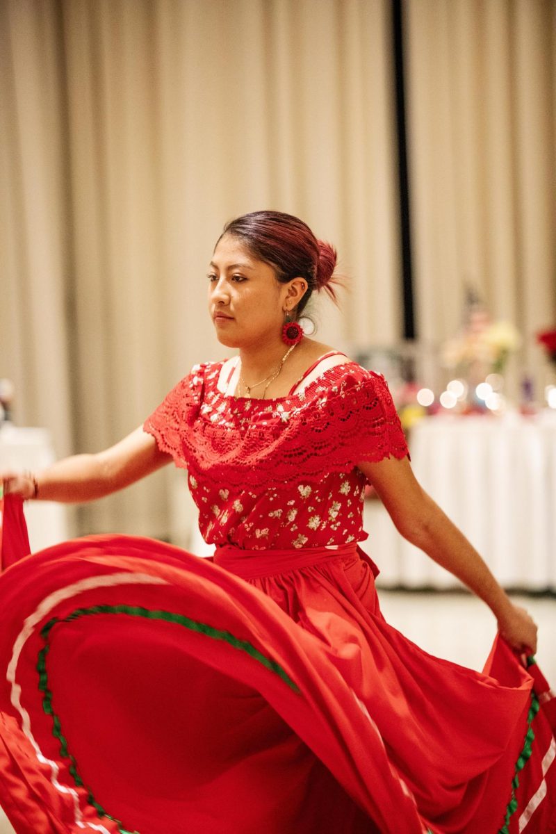 Alexandra Martinez, a communication disorders and sciences major, performs a Mexican folkloric ballet along with other students for the Dia de Los Muertos Gala on Saturday night