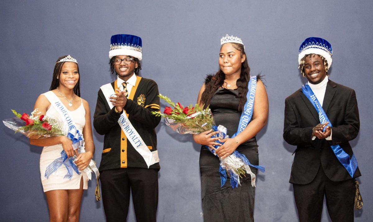 The 2023 EIU Homecoming Royalty Court winners, Rochelle Carter as Princess, Sheldon Turner as Prince, Hannah Lawrence as Queen, and Nick Trimble as King, take the stage at the homecoming royalty coronation Monday night.