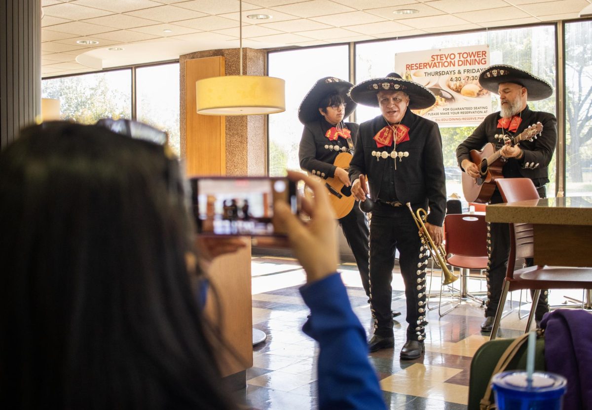 Kenia Gonzalez records the Los Amigos band as they play a song she requested in Stevenson Dining Hall. Gonzalez said, It was amazing to see the university celebrate and acknowledge Latino Heritage Month with a mariachi band on campus. I hope we continue to see more culturally enriching activities like this.