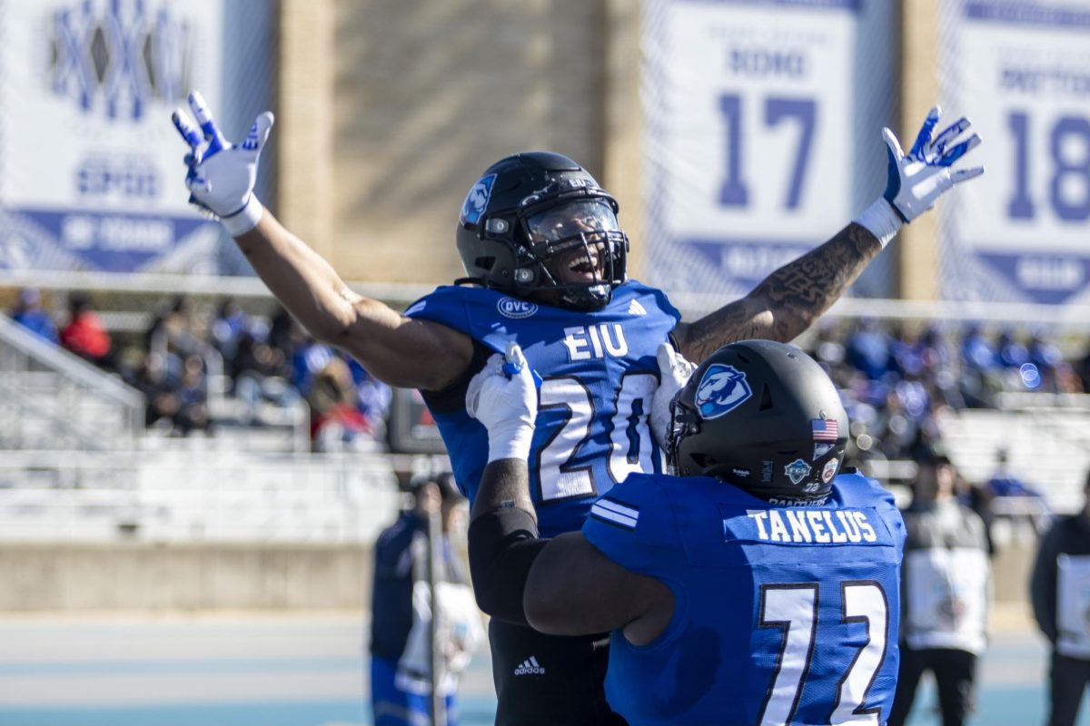 Redshirt freshman running back MJ Flowers (20) celebrates a touchdown with redshirt junior offensive lineman Elkhanan Tanelus (72). Eastern beat Tennessee State 30-17 Saturday afternoon at O’ Brien Field.