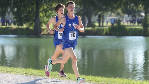 Freshman Joe Stoddard (117) runs at the 2023 EIU Walt Crawford open.