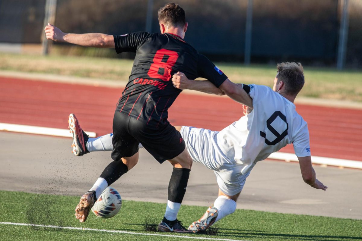 Sam Eccles, a senior forward (9) attempts to steal the ball from senior Incarnate word midfielder Luis Zuniga (8) during their OVC semifinals tournament held at Ralph Korte Stadium wednesday evening.