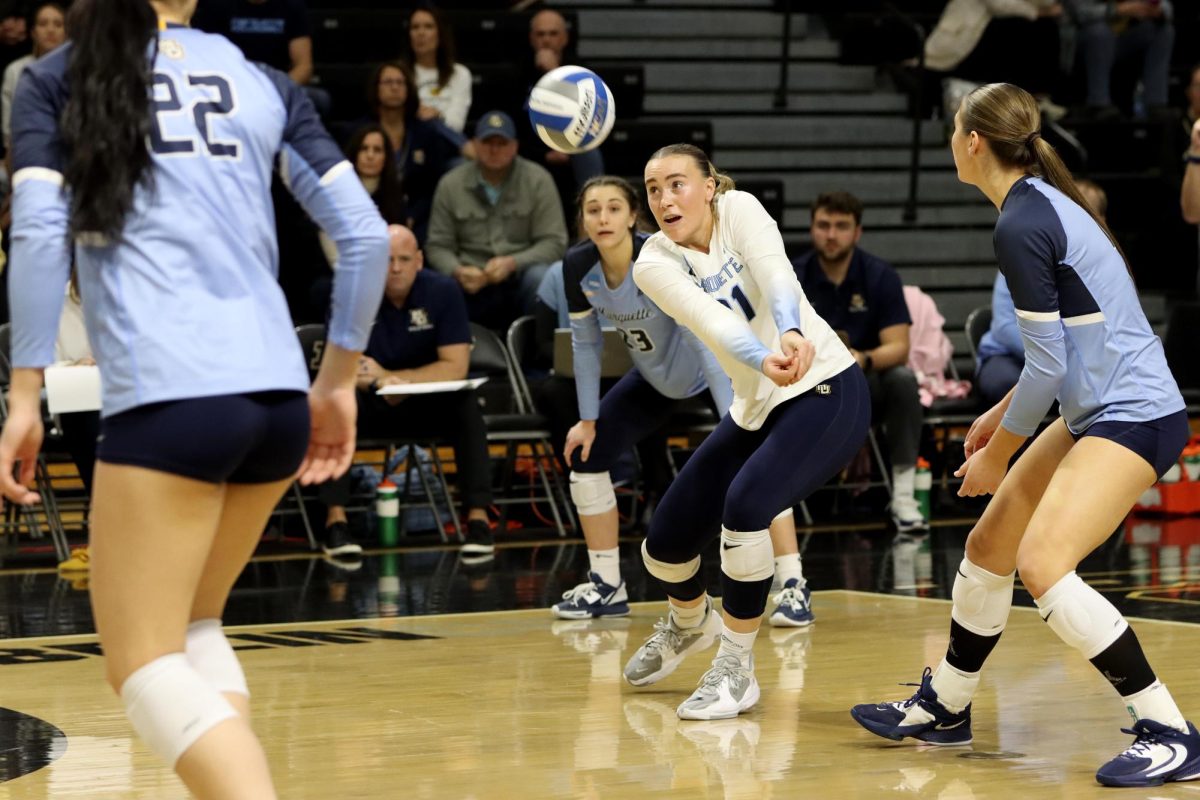 Graduate libero Sarah Kushner returns the ball after a serve during the first round of the NCAA tournament against the Panthers.