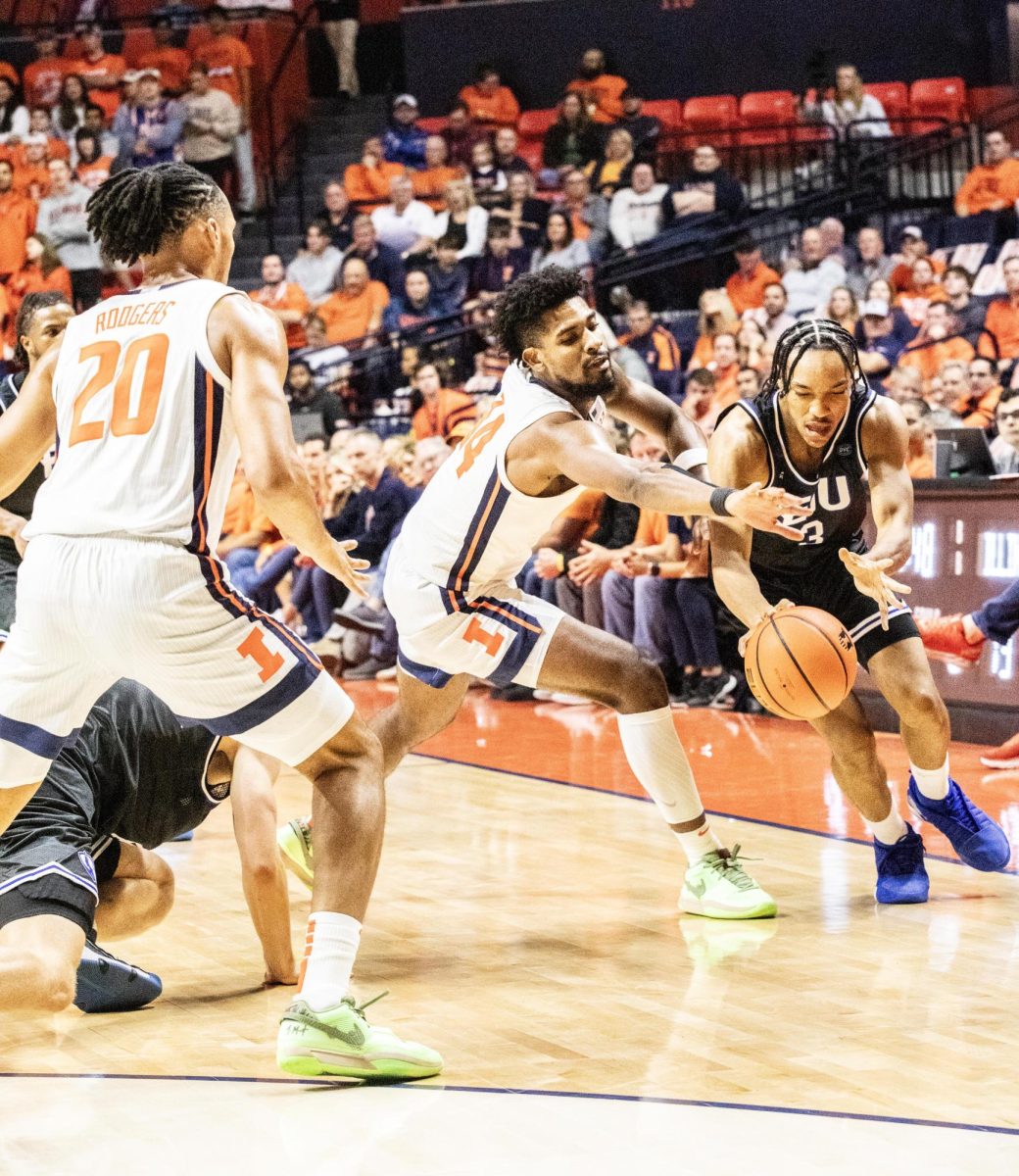 Guard Naykel Shelton (3) tries to dribble past the defender. The Panthers lost 52-80 to the Fighting Illini Monday night. 