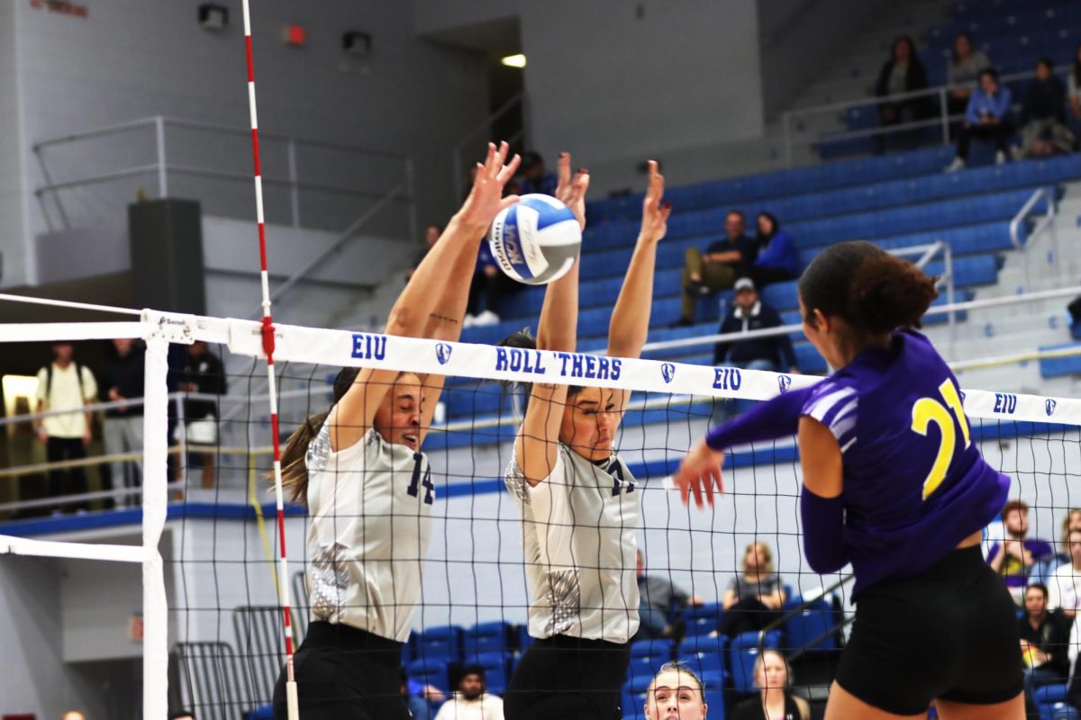 Outside hitter/opposite Lilli Amettis (14), and middle blocker Julia Stanev (17) attempt to block the ball. The Panthers won 3-1 against Western Illinois Leathernecks. 