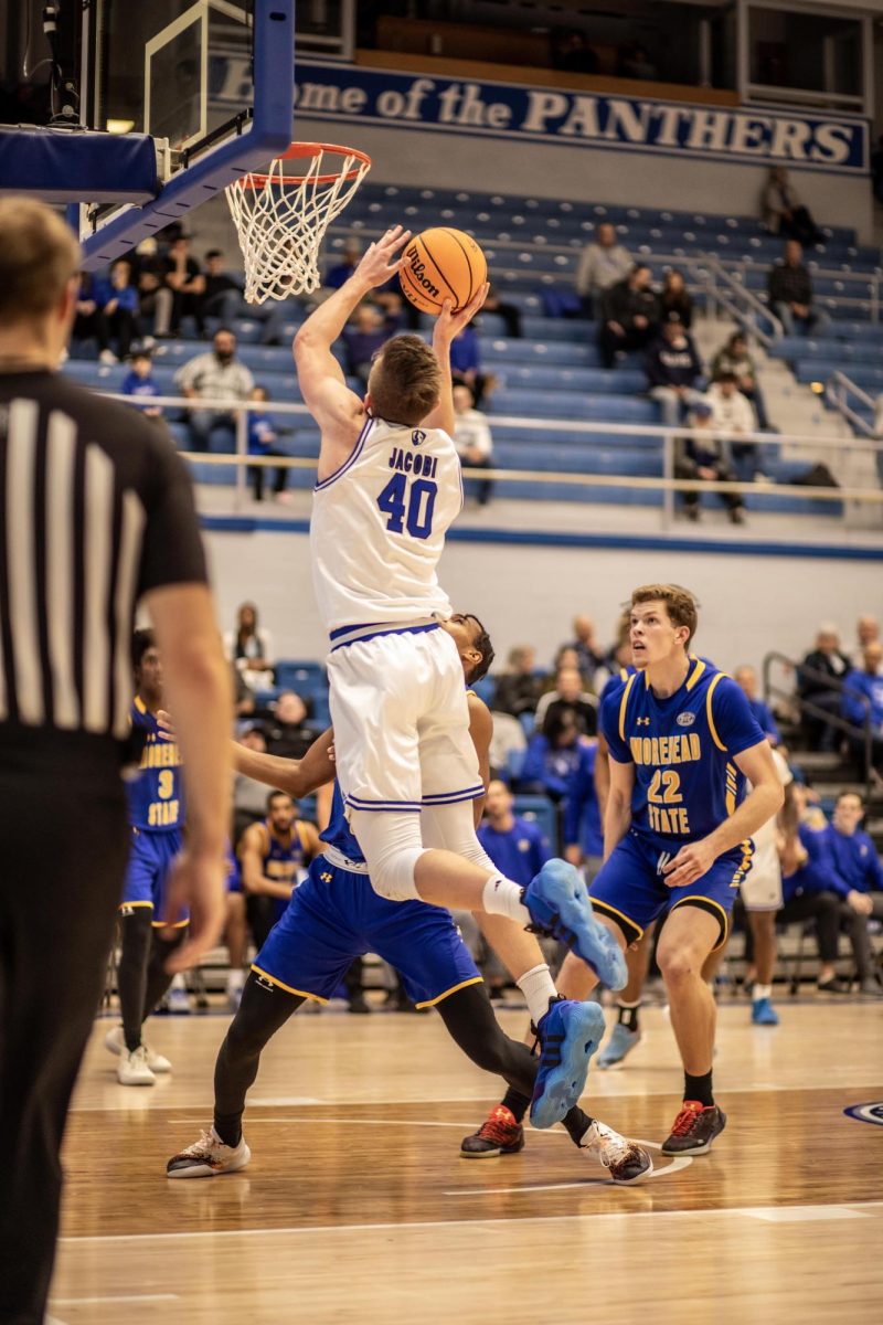 Sophomore forward Kooper Jacobi scores a point against Morehead State Thursday evening in Groniger Arena.