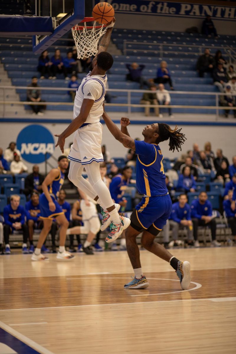 Junior guard Kyndall Davis makes the first dunk of the night against Morehead State Thursday in Groniger Arena 