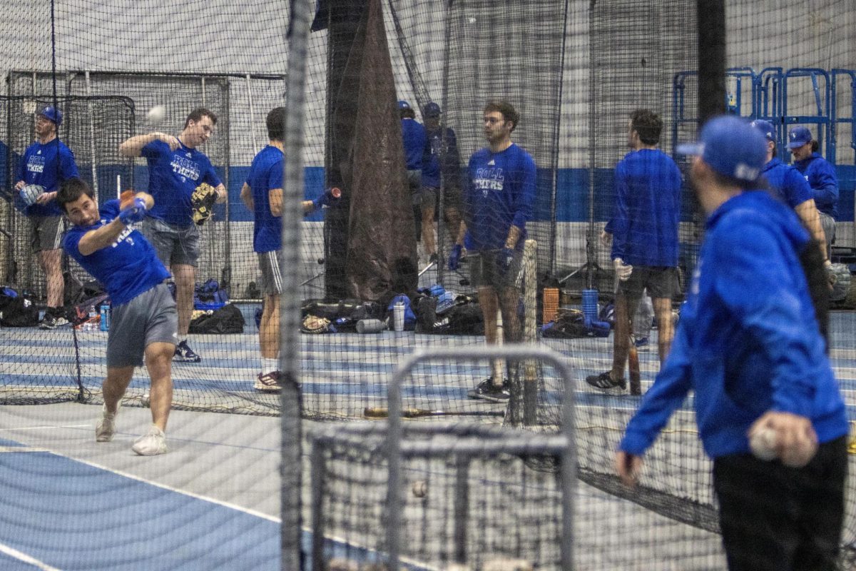 Easterns mens baseball team practices in the Lantz Indoor Fieldhouse on Thursday evening. The teams first game will be against the Florida A&M Rattlers on Feb. 16 in Tallahassee at Bragg Memorial Stadium at Florida A&Ms campus. 