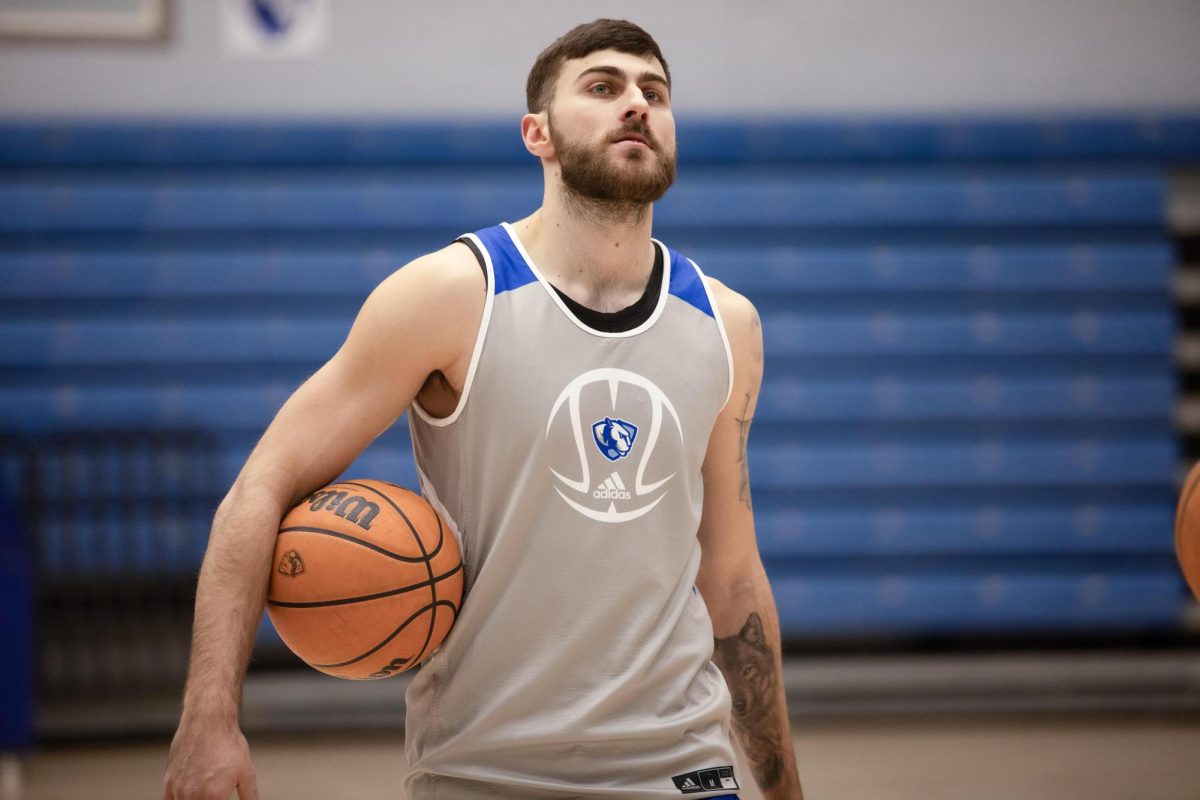 Redshirt sophomore Lazar Grbovic listening to the coaches instruction during basketball practice in Groniger arena on Eastern Illinois university, Wednesday evening. 