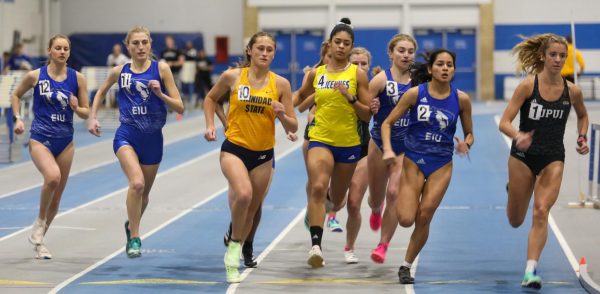 (From Left to Right) Rachel Koon (12), Kylie Decker (11), Kathryn Cichon (3) and Brenda Torres (2) vie for positioning at the beginning of the mile run at track meet.