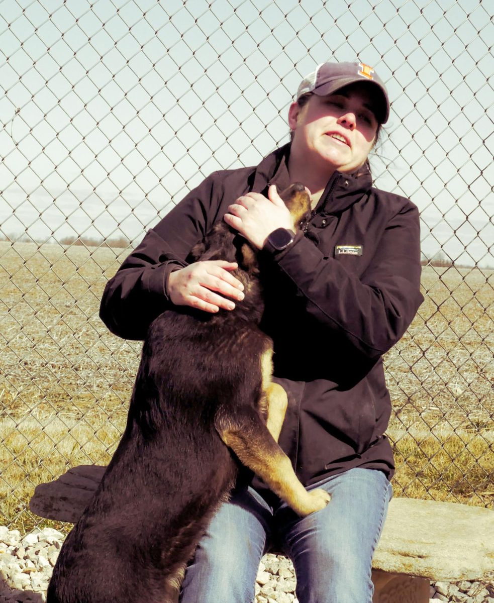 Stacy Forcum spends time with Sally Mae, a lab shelter dog. Forcum is a volunteer who often comes to help with the animals, at the Coles County Animal Shelter.