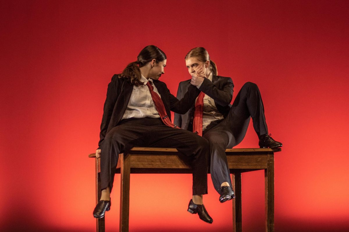 From right Mandy Transon, a senior early childhood special education major, locks hands with Rachel Wisner, a sophomore accounting major, at the end of their duet The Other Side from The Greatest Showman by Hugh Jackman and Zac Efron during the second dress rehearsal Wednesday at The Theatre at the Doudna Fine Arts Center. The two codirected the show and came up with the shows theme Time of our Lives because Transon is graduating and has had the time of her life and Wisner is just now starting to have the time of her life.