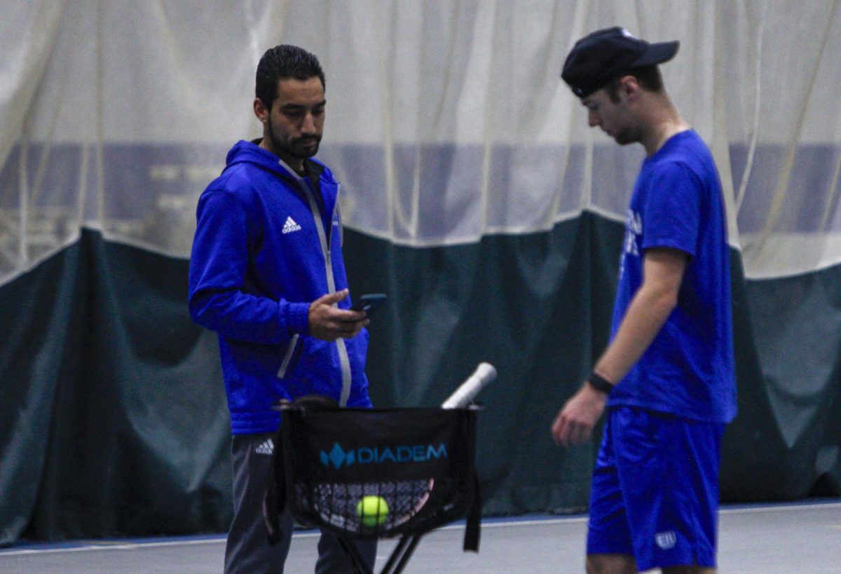 Head Coach Robin Cambier (mens and womens tennis) during pratice on wed Feb 14, 2024, helping players improve skills Macfee on Eastern Illinois University in Charleston Ill © 