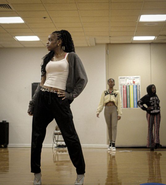 Tiffany Hunter, a 22-year-old Charleston resident, poses in the Kat Walk practice on Thursday in Groniger Arena on Eastern Illinois University’s campus in Charleston, Ill.
