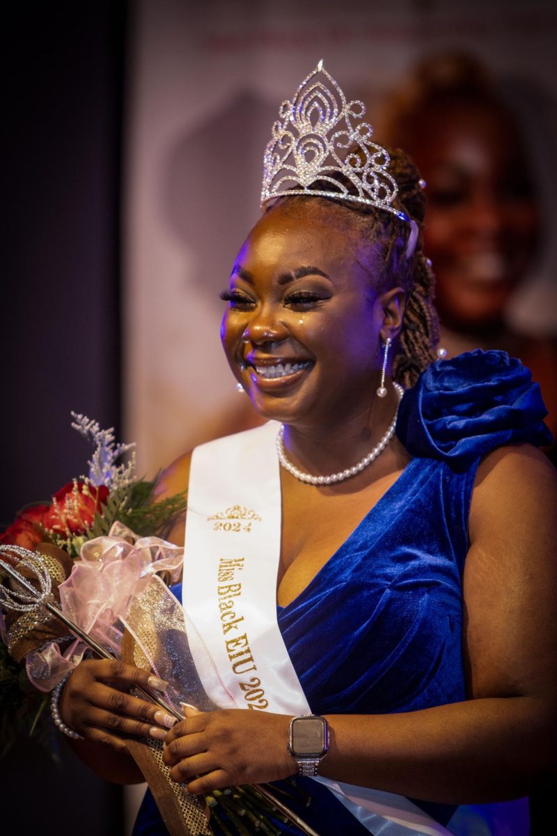 Shades of an Ebony Queen  Miss Black EIU scholarship pageant 2024 newly crowned Rafiat Yarrow, senior, political science major, at the Grand ballroom Martin Luther King JR Union on Saturday evening, Feb 24, 2024.,taking her first walk as Miss Black EIU 2024 