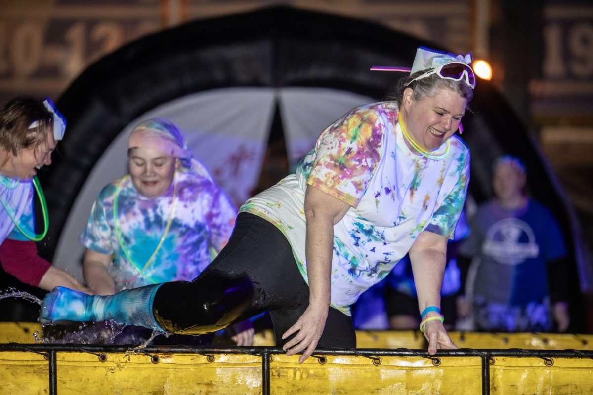 Jennifer Buchter, a special education professor, gets out of the water during the Special Olympics Polar Plunge Sunday.