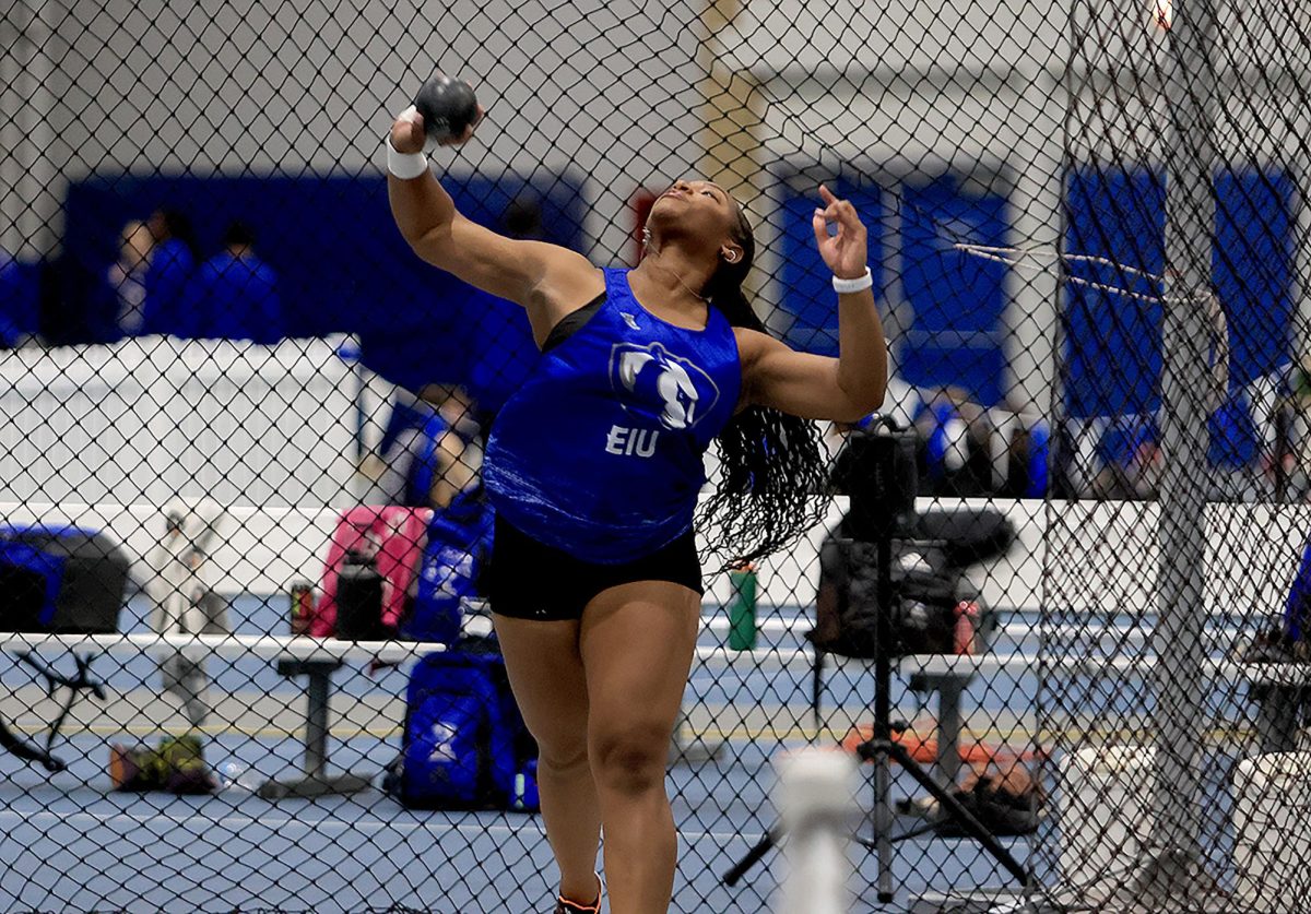 Track and field senior thrower Taylor Iverson throws a shot put .