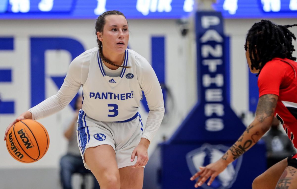 Junior guard Miah Monahan dribbles the ball while looking for a pass during the womens basketball game against the Southeast Missouri State University Redhawks Thursday evening at Groniger Arena. Monahan scored 6 points and had 7 assists. The Panthers won 72-52 against the Redhawks.