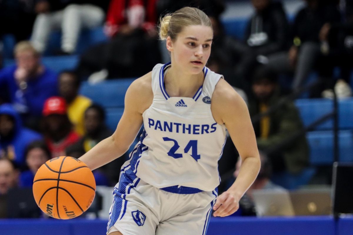 Sophomore guard Ellie Buzzelle dribbles the ball while looking for a pass during the womens basketball game against the Southeast Missouri State University Redhawks Thursday evening at Groniger Arena. Buzzelle scored 8 points and had 4 rebounds. The Panthers won 72-52 against the Redhawks.