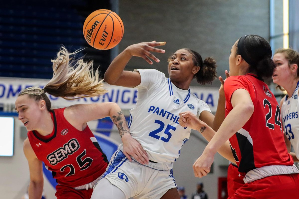 Taris Thornton (25), a junior forward, scramble for a loose ball while being pressured by Southeast Missouri State University Redhawks during the womens basketball game Thursday evening at Groniger Arena. Thornton scored 10 points and had 2 rebounds. The Panthers won 72-52 against the Redhawks.