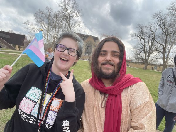 Jacob Kimsey poses with Ethan Lozada dressed as Jesus at a counterprotest against religious protester Chris Svochak.