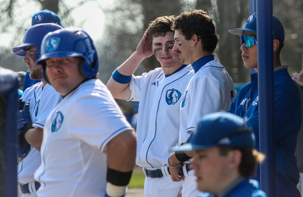 Mens Baseball team players stand in the dugout at home against Bellarmine at Coaches Stadium on March 12, 2024. Eastern beat Bellarmine 9-4 Tuesday afternoon.