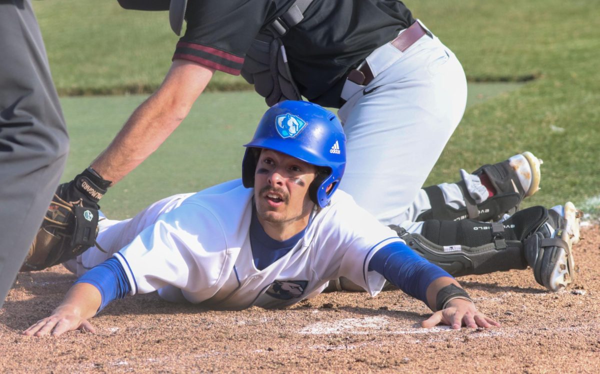 Infield redshirt senior Robby Taul slides to home base incomplete during the mens baseball game against Bellarmine University at Coaches Stadium on March 12, 2024.