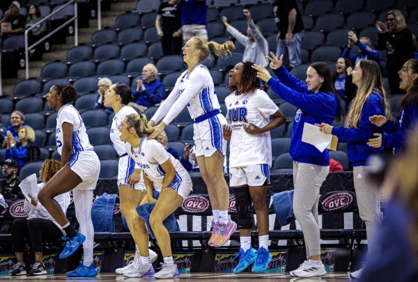 The EIU Womens basketball bench gets excited as the team scores and advances to the next game Thursday.