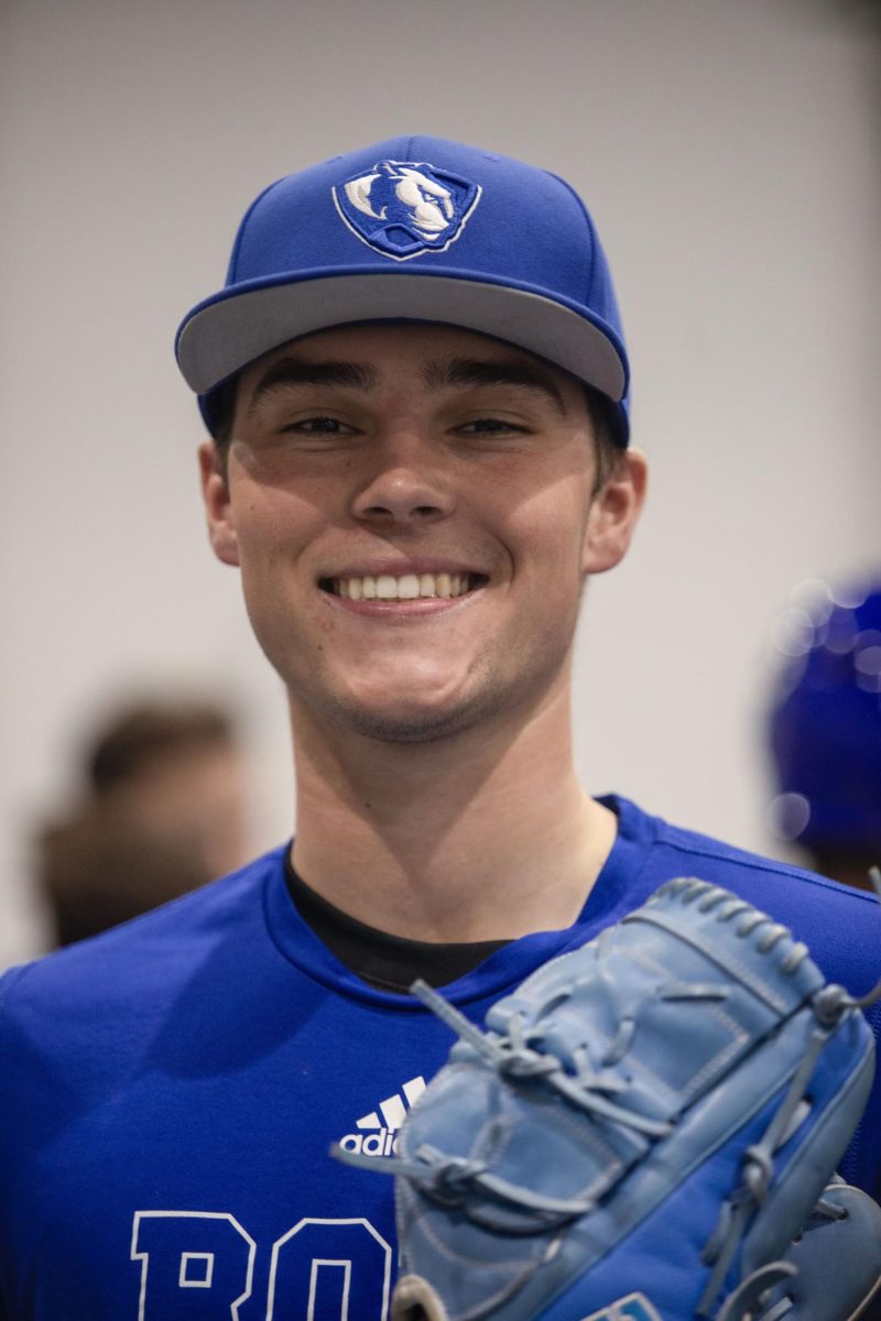 Freshman, right-handed pitcher, Slater Wilcox, poses for portrait during baseball practice in Lantz Indoor Fieldhouse