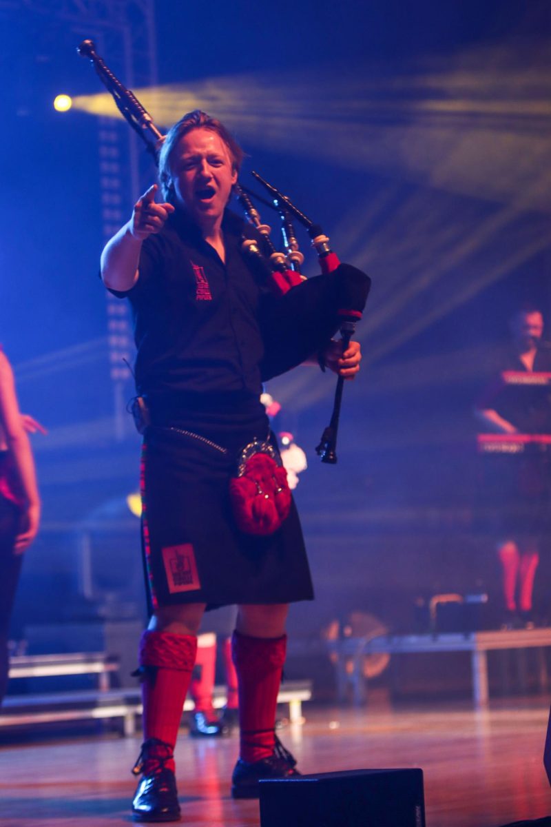 From left, bagpipers Willie Armstrong, Andrew Brodie, lead singer Chris Judge, and bagpipers Ross Miller get the audience to sway their hands from side to side during the Red Hot Chilli Pipers performance Saturday.