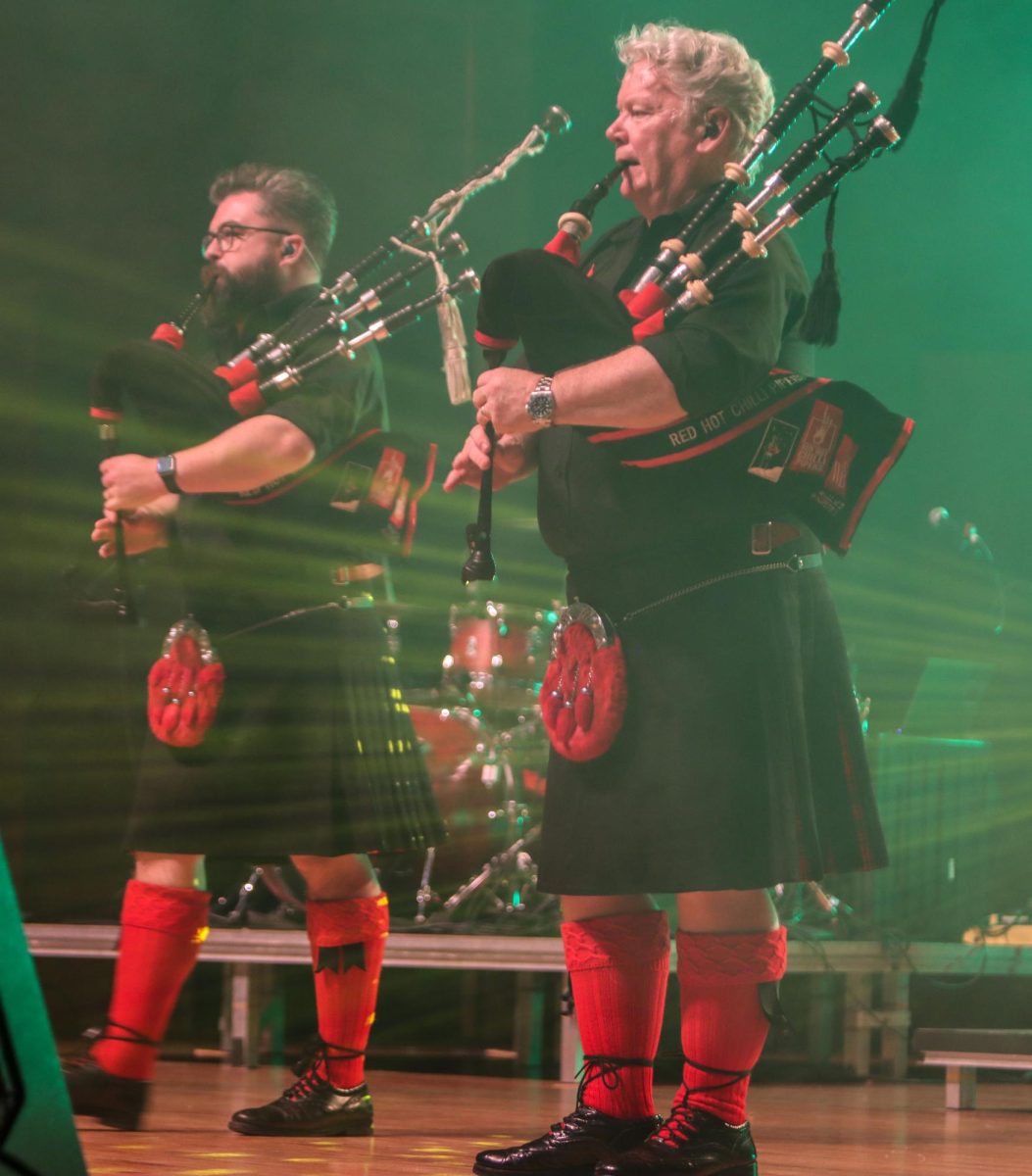 From left, bagpipers Ross Miller and Willie Armstrong play together during the Red Hot Chilli Pipers performance held in the Dvorak Concert Hall Saturday. 