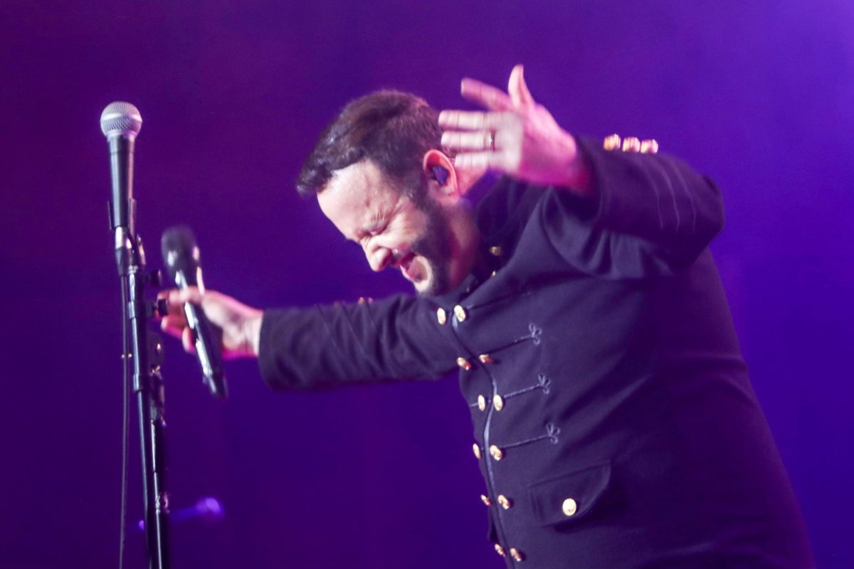 Lead singer Chris Judge hypes up the audience to sing along during the Red Hot Chilli Pipers performance held in the Dvorak Concert Hall Saturday. 