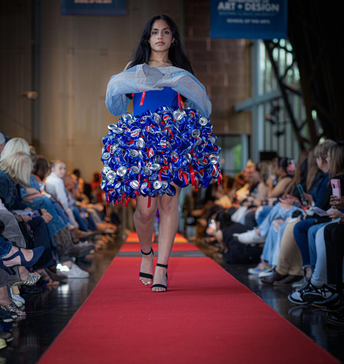 Lynn Everly Tran walks the Denim Day Fashion show in her sparks fly dress designed by Alicia Franciskovich in Doudna Fine Arts Center 